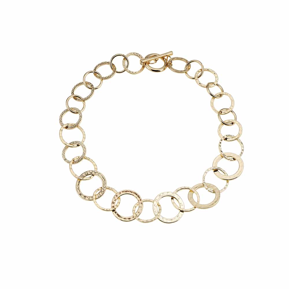 Produktbillede af Køb Armbånd guldfarvet klassisk design med ringe toggle lås på tilbud